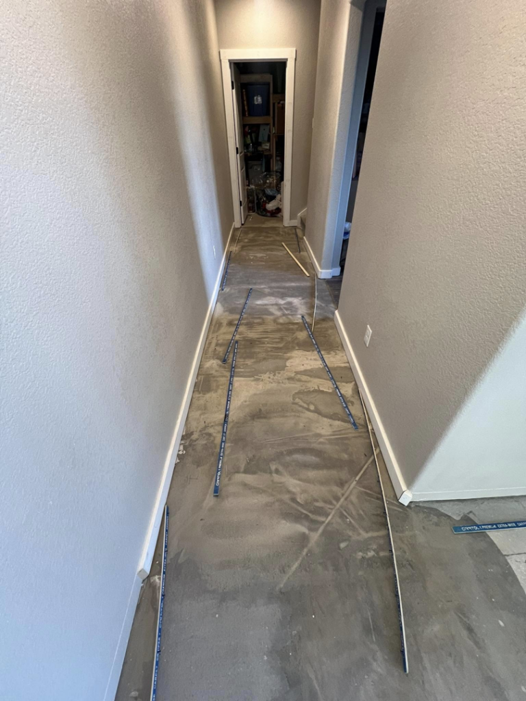 A hallway with subfloor prepared for new flooring installation by Elite Flooring Professionals in Pueblo, CO.