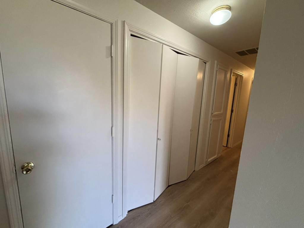 A clean hallway with freshly painted doors, demonstrating handyman services by Full Throttle Remodel in Salem, OR.