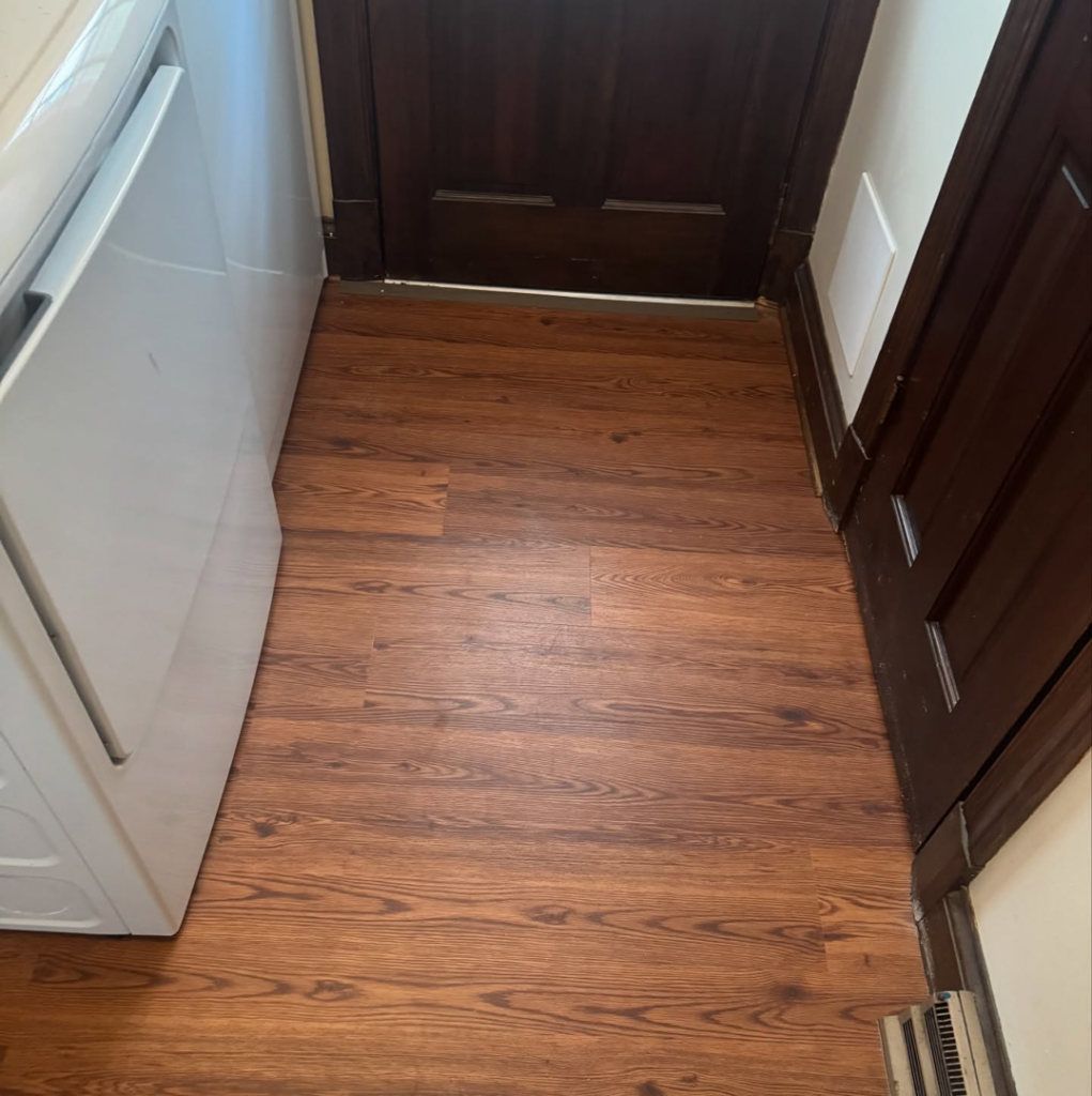 Hallway with new wood-look flooring installed by Sanchez & Hall Construction in Richmond, VA.
