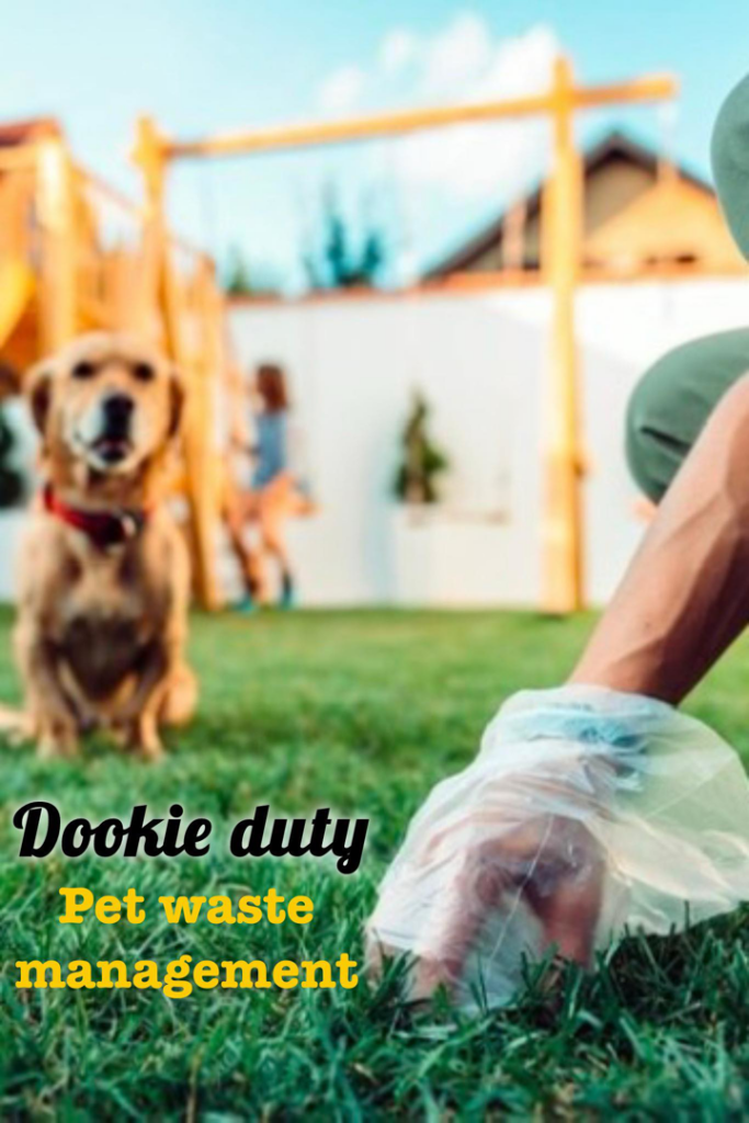 A person's hand in a plastic bag scooping pet waste from a green lawn, demonstrating Dookie Duty's service in Appleton, WI.
