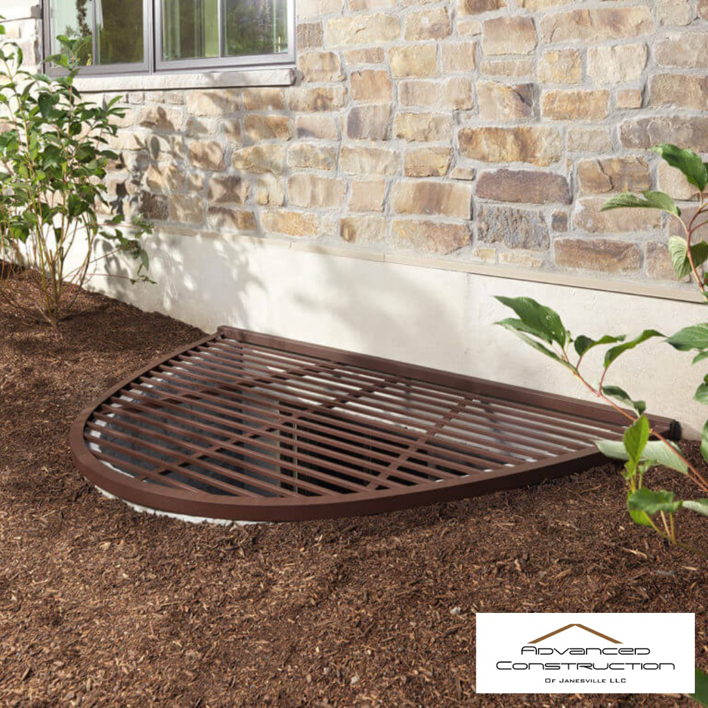 Hands installing a new gutter system on a house, showcasing handyman services by Advanced Construction of Janesville LLC in Janesville, WI.