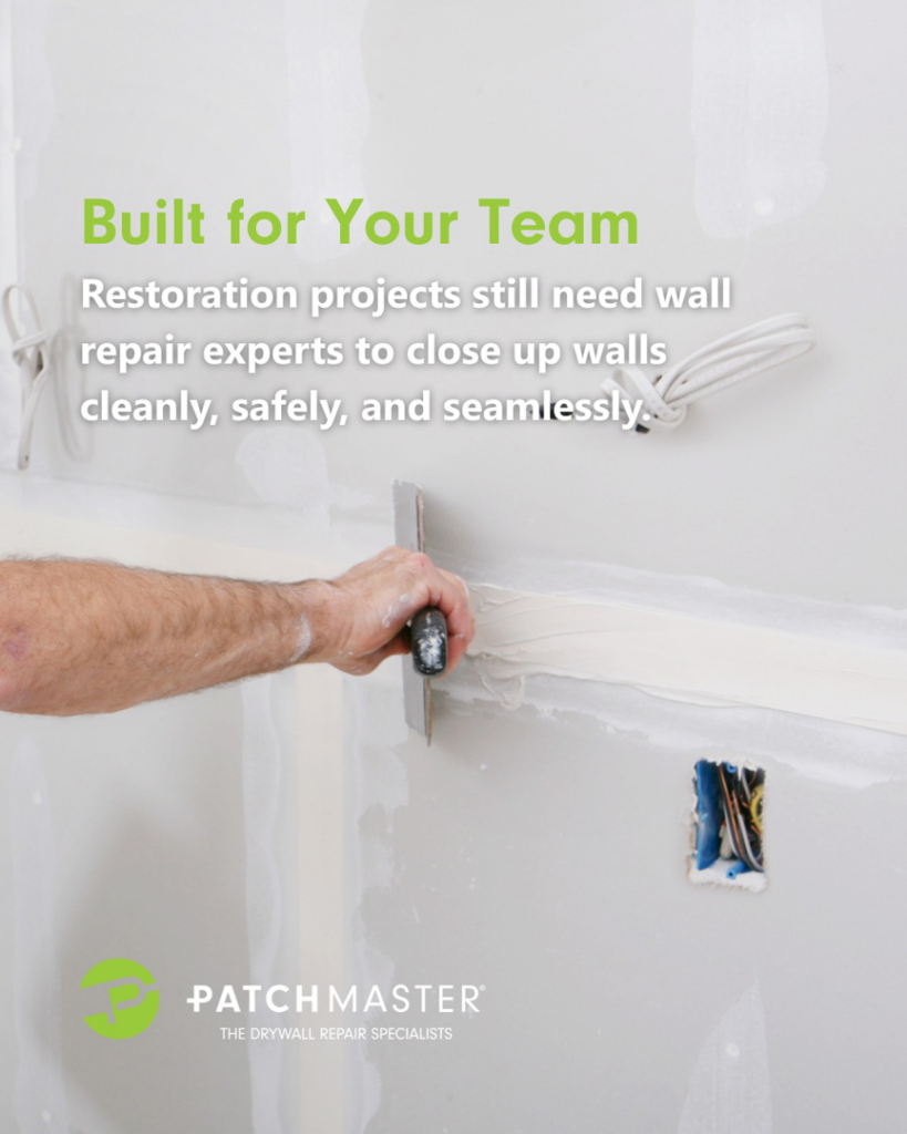 A handyman's hand applying joint compound to a drywall seam with a trowel, performing repair for PatchMaster Saint Charles County in O'Fallon, MO.