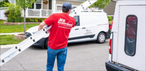 A handyman from Westlake Ace Handyman Services Kansas City Metro carrying a ladder to a job site in Lenexa, KS.