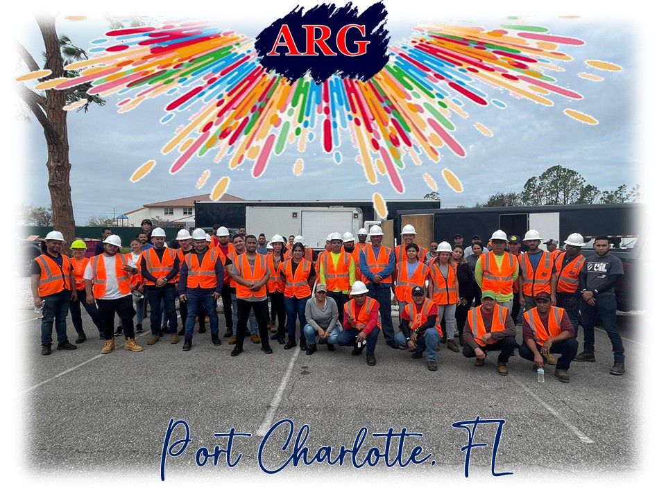 American Relief Group (ARG) handyman crew in hard hats and safety vests at a work site in Kenner, LA