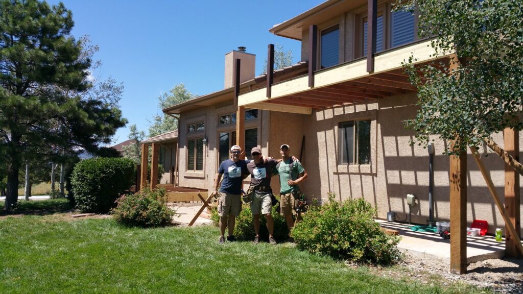A handyman crew from Element Construction Company working on building a new deck in Colorado Springs, CO.
