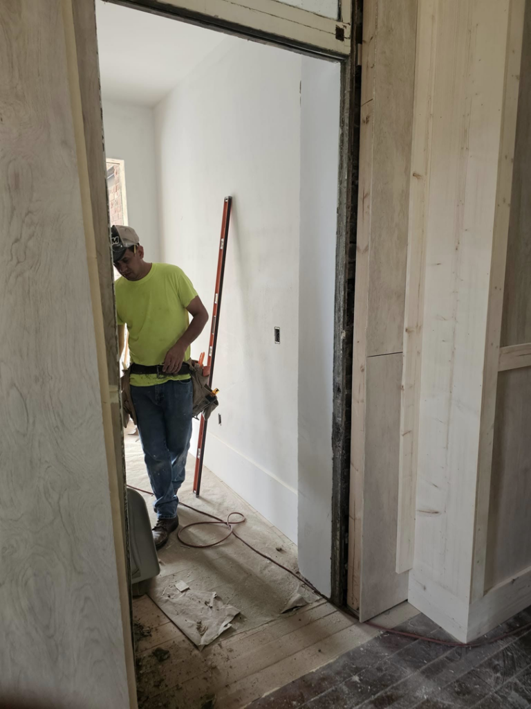 A handyman from Detweiler Construction, LLC installing an interior door frame in Horse Cave, KY.