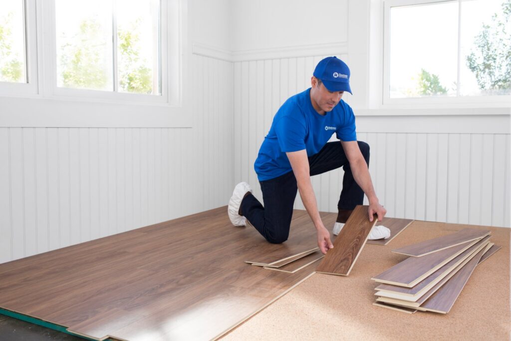 A Handyman Connection of Wichita East professional installs laminate flooring in Wichita, KS.