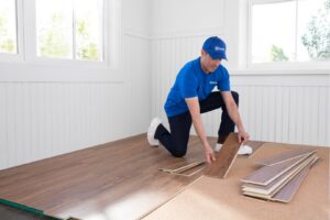 A Handyman Connection of Wichita East professional installs laminate flooring in Wichita, KS.