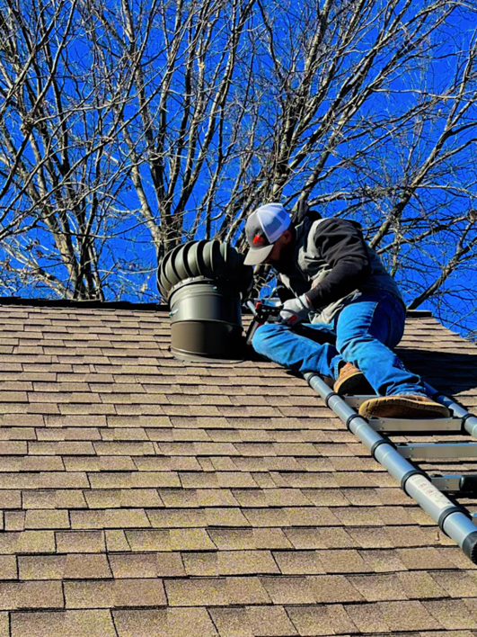 A handyman from South Fugate Construction LLC installing a roof vent during a job in Tulsa, OK.
