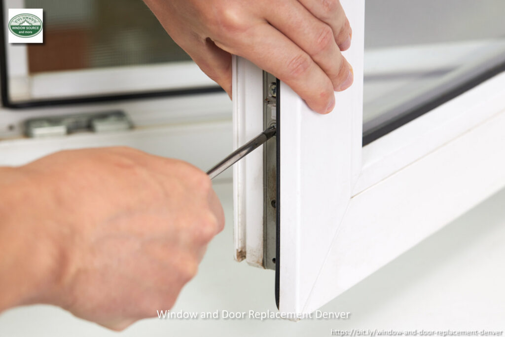 A handyman repairing or installing a window mechanism for Colorado Window Solutions in Denver, CO.