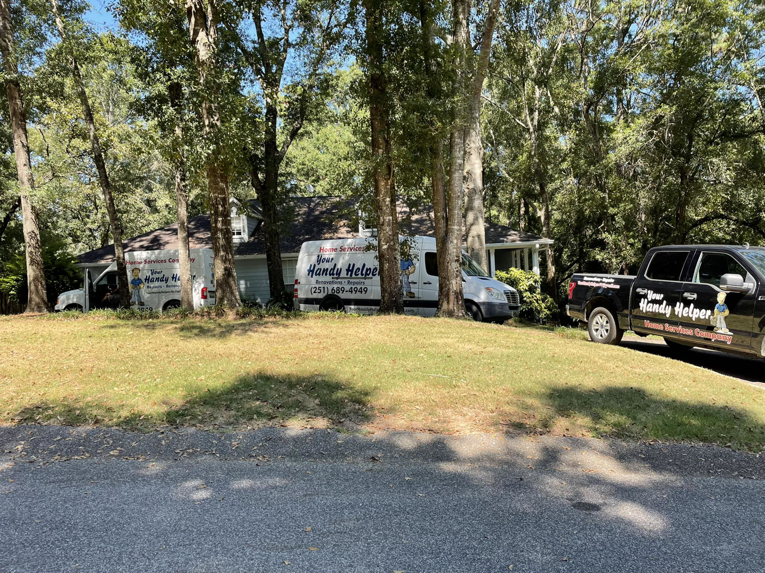 Your Handy Helper service vans and truck parked at a residential home, ready to provide handyman services in Mobile, AL
