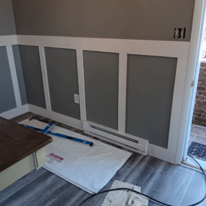 Handyman tools, drop cloth, and wainscoting installation in progress by Carter's painting in Martinsburg, WV.