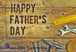 Handyman tools including a hammer, nails, wrenches, and a ruler on a wooden background for Southern Elite Contracting Athens GA in Monroe, GA.