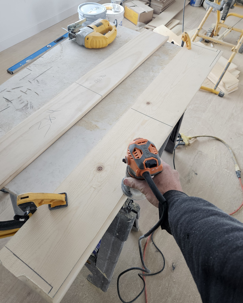 A handyman using a router tool on a piece of wood for a project by Do It Right Or Do It Twice, LLC in Denver, CO.