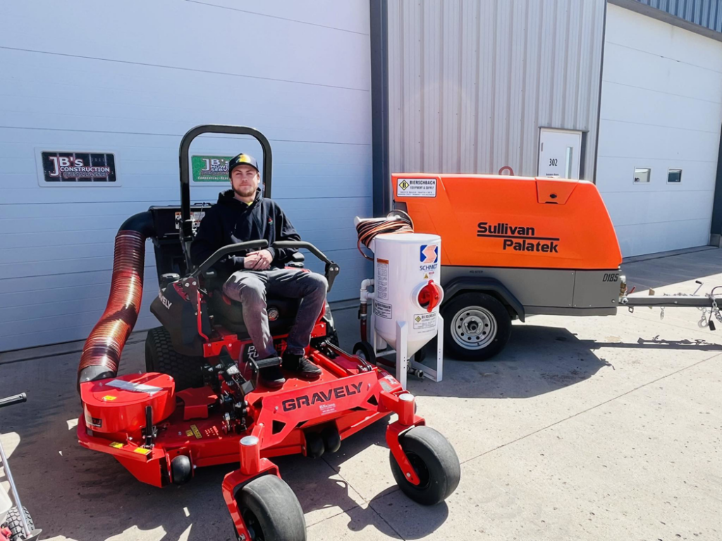 A handyman with a zero-turn mower and sandblaster ready for various services at JB's Mowing & Misc Services in Aberdeen, SD.