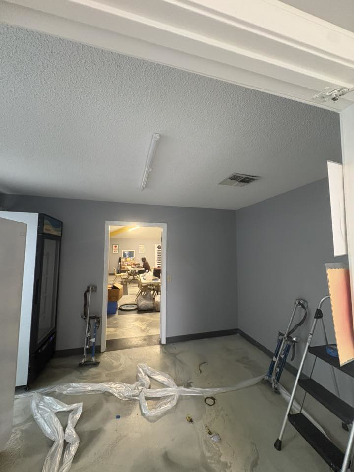 Handyman work in progress with tools and plastic sheeting on the floor by Diamond Drywall LLC in Buda, TX