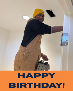 A handyman from Plains Electric on a step stool, installing or repairing a ceiling light fixture in Auburn, AL.