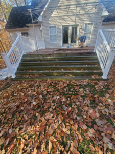 A handyman from Handyman Hal working on a deck repair project, replacing boards in Wilmington, DE.