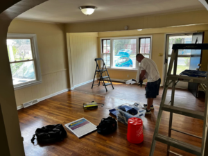 A handyman actively working on an interior home improvement project for Star Mountain Realty LLC in Roanoke, VA.