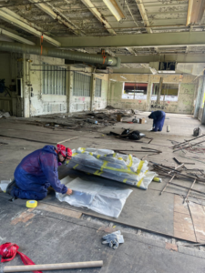 Handymen preparing materials during an interior renovation project by TRM Staffing LLC in Indianapolis, IN.