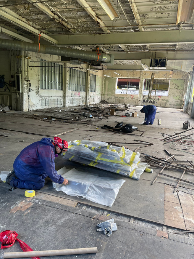 Handymen preparing materials during an interior renovation project by TRM Staffing LLC in Indianapolis, IN.