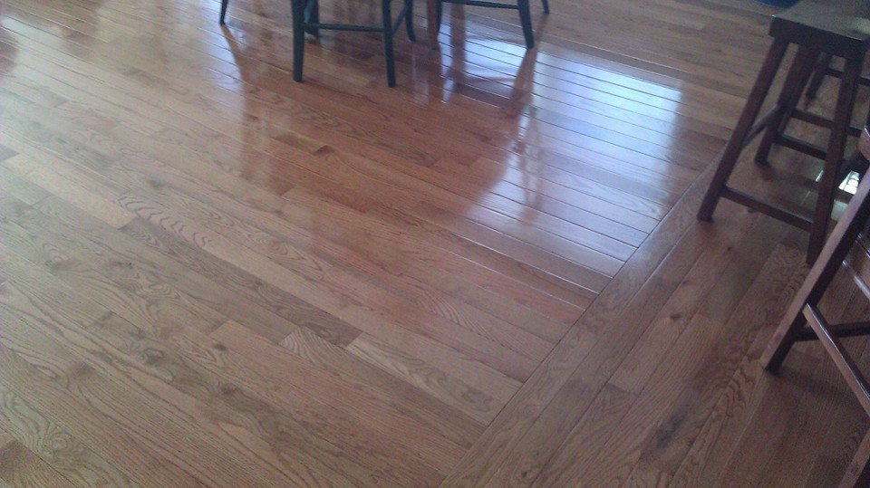 Detailed view of a hardwood floor installation with a unique pattern by Cliff's Construction in Richmond, VA.