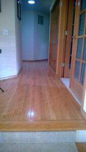 New hardwood floor installation in a hallway, a home improvement service by TPF Services in Yakima, WA.