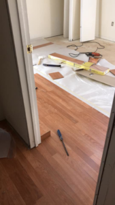 Professional hardwood flooring installation in progress by Changing Spaces Construction LLC in Portland, OR.