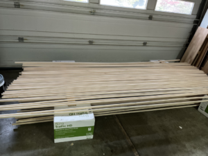 Hardwood flooring planks and Bona finish boxes, materials for a project by Birdseye Hardwoods LLC in Portland, OR