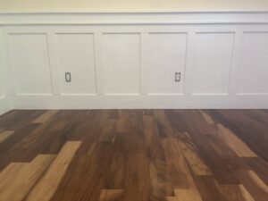 New hardwood flooring and wainscoting installed by Denver House Repair in Lakewood, CO.