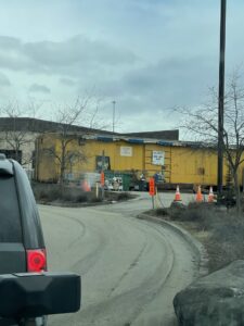 A hazardous material collection point with a yellow building at Municipality of Anchorage Solid Waste Services in Anchorage, AK.