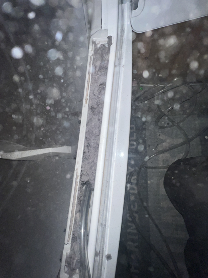 A heavily clogged dryer lint trap area, showing the need for cleaning by Elite Vent Cleaning in Bluebird Lane.