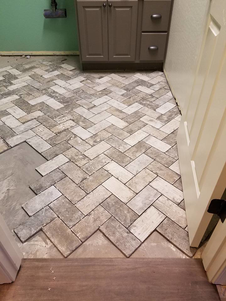 Herringbone pattern tile floor installation in progress by Clayton Family Tile, LLC in Chandler, AZ
