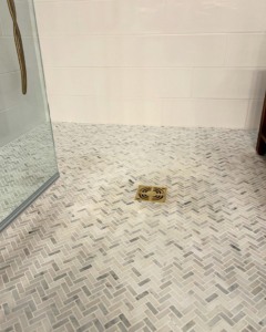Herringbone tile shower floor installation by Wilson-Covington Construction in Winston Salem, NC