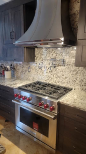Installation of a high-end kitchen range and custom hood by Walker Kitchen Design in Granby, CT.
