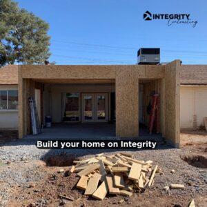 An exterior view of a home addition under construction with new framing by Integrity Contracting in Cleveland, OH