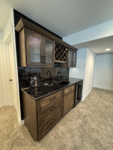 Professional installation of home bar cabinetry, countertop, and tile backsplash by McWilliams & Company in Ketchum, ID.