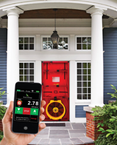 A home energy audit with a blower door test and smartphone display by Green Energy Testing in Tampa, FL.