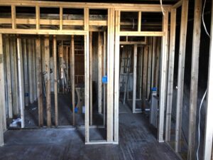Interior home framing with electrical boxes installed during a renovation by AES Electrical Contractor in Richmond, VA.