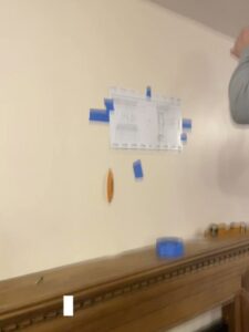 Home improvement project preparation with blueprints taped to a wall by JAC Home Improvement LLC in Danbury, CT.