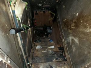 An interior view of a home under renovation, showing new wooden framing by J-BO Enterprises, Inc in Wilmington, MA.