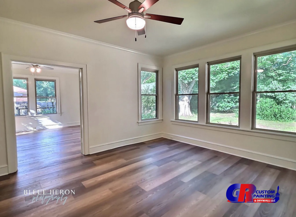 An interior view of a home renovation project with new flooring and fresh paint completed by GR Custom Painting & Drywall LLC in Shreveport, LA.