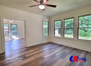 An interior view of a home renovation project with new flooring and fresh paint completed by GR Custom Painting & Drywall LLC in Shreveport, LA.