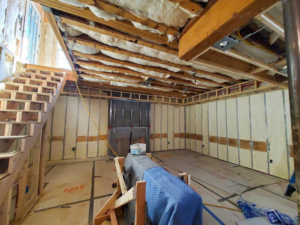 An interior home renovation project showing insulation and framing work by Harry Braswell, Inc. in Alexandria, VA
