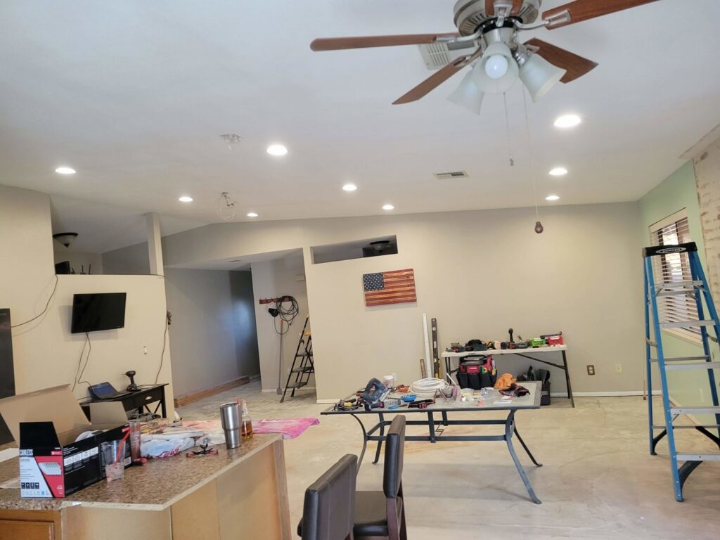 A home renovation project in progress with tools, ladders, and new recessed lighting installed by McCarran Handyman Services in Boulder City, NV.