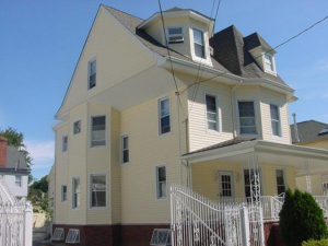 Exterior view of a residential home after siding and window replacement by Allaico Construction in Elizabeth, NJ.