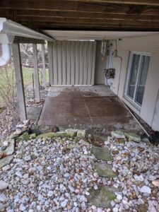 The outdoor patio area after an old hot tub has been removed, showing a clean space by 1-800-Declutter in Cincinnati, OH.