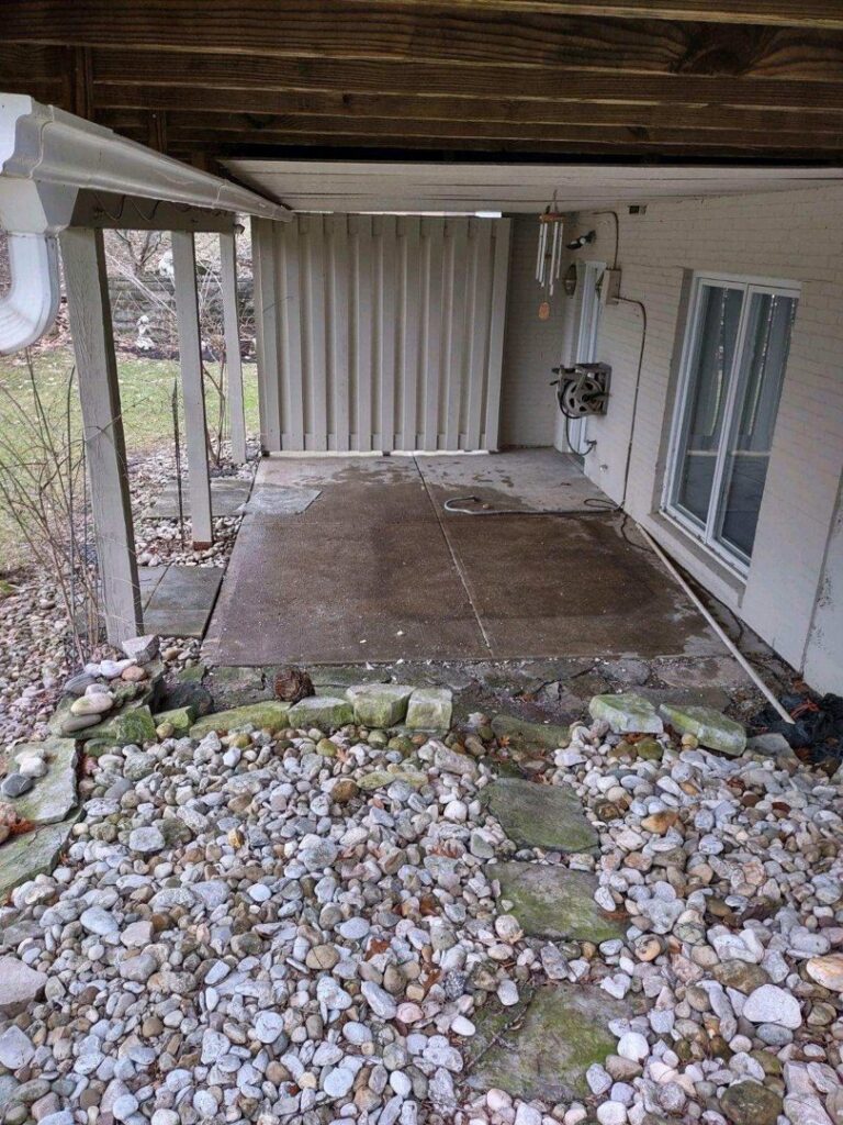 The outdoor patio area after an old hot tub has been removed, showing a clean space by 1-800-Declutter in Cincinnati, OH.