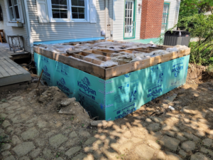 A house addition foundation under construction with wood framing and insulation boards by Renew Additions & Remodeling, LLC in Columbus, OH.
