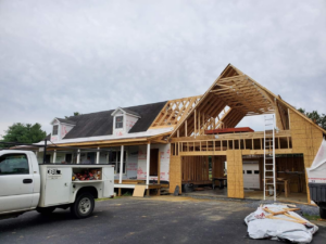 A house under construction with new framing for an addition, showcasing work by DBB, Inc. in Harrisonburg, VA.